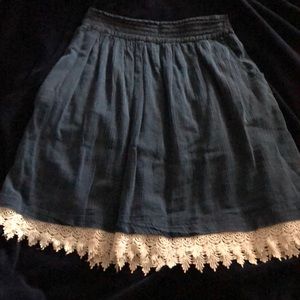 Blue knee length skirt with lace at the bottom